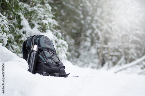 hiking backpack lies in the snow