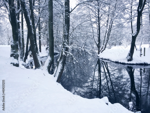 Winter landscape with small river. photo