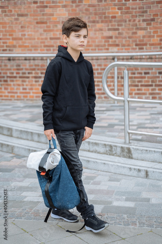 Boy with school backpack. Back to school. Teenagers leisure
