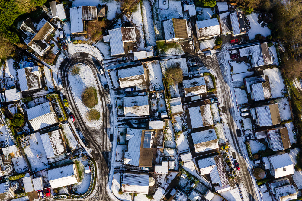 Aerial view of small residential streets covered in snow during winter