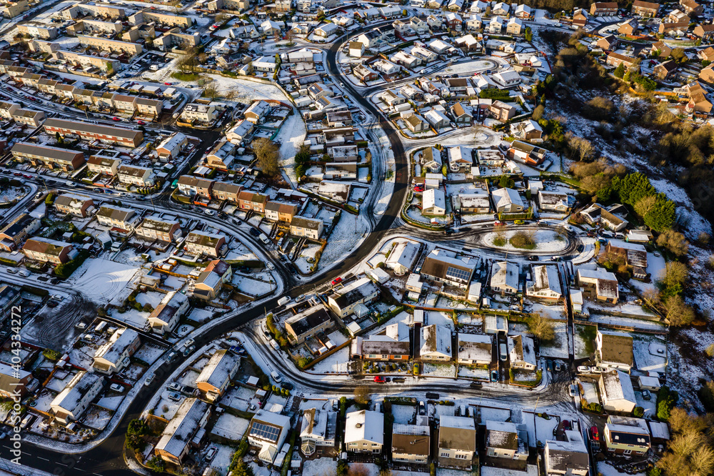 Aerial view of a snow covered town on a bright, sunny winters day
