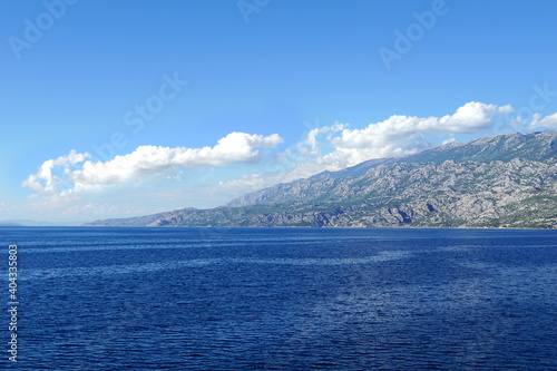 Mountain range along the blue sea, clear, unpolluted nature