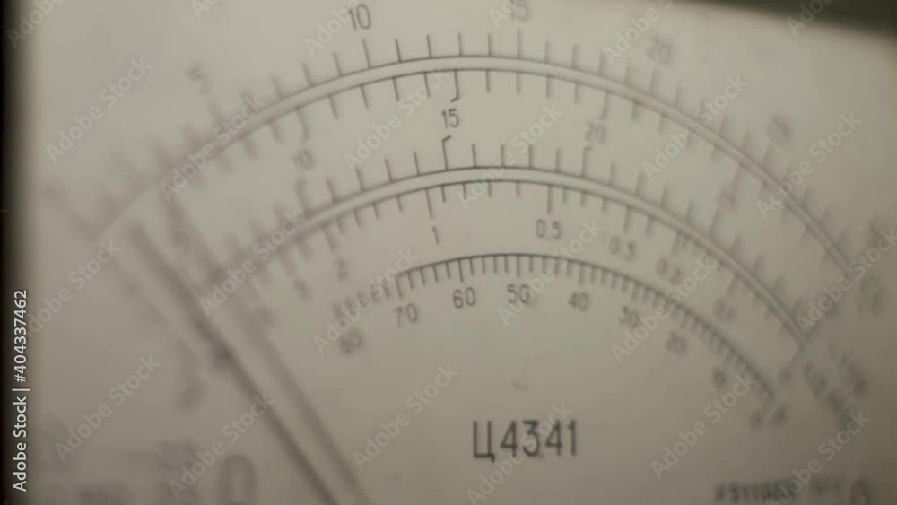 Close up. Meter Scale and Arrow. Level measurement. Ohms, decibels, volts, amps, capacity. Sequence. Close up. Meter Scale and Arrow. Level measurement. Ohms, decibels, volts, amps, capacity. Sequence.
