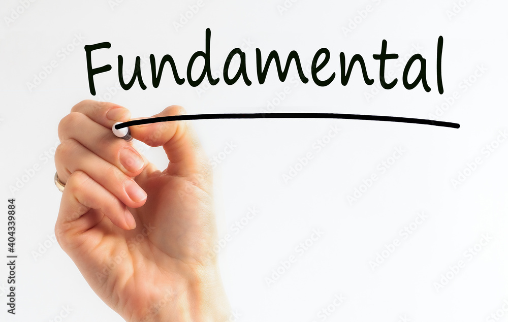 Hand with marker writing the word Fundamental, concept, stock image Hand with marker writing the word Fundamental, concept, stock image