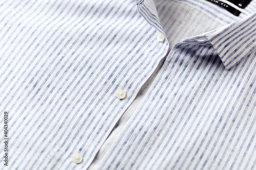 Close up of men's striped shirt. Cotton fabric.