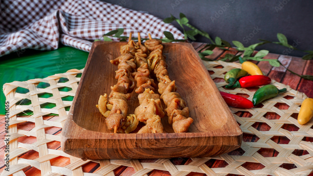 selective focus - sate usus or chiken intestines satay. traditional Indonesian street food selective focus - sate usus or chiken intestines satay. traditional Indonesian street food