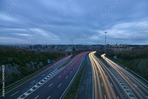 Photography Beautiful very long exposure evening view of light trails of vehicles on motorway M50 Dublin, Ireland