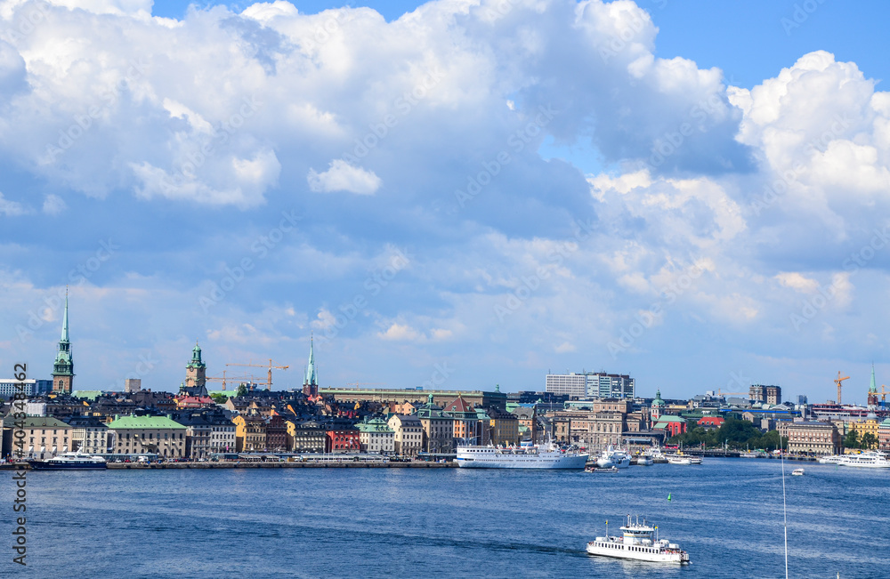 Famous scenic view of cityscape of embankment In Old Town Gamla Stan in summer day. Stockholm, Sweden. 