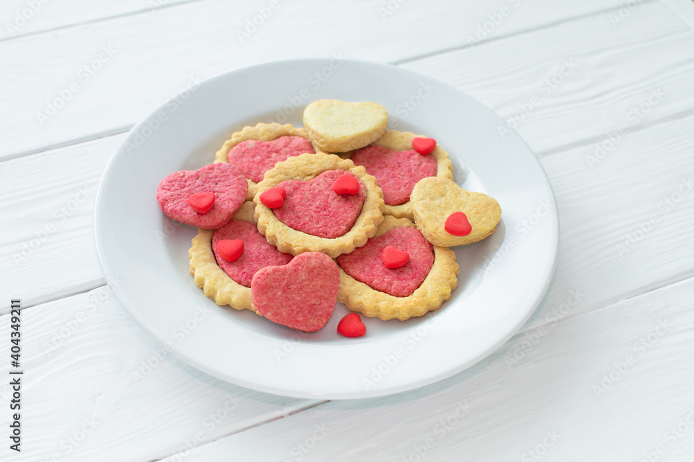 Valentine's day cookies on a plate Step by step 5. Cooking instructions. Love concept. Homemade heart shaped cookies. Delicious natural organic cookies, baked goods with love for valentines day