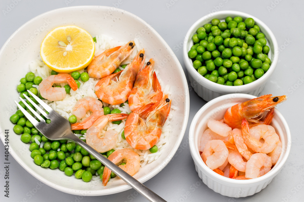 Shrimp with green peas in gray bowl. Shrimp and green peas in bowls Shrimp with green peas in gray bowl. Shrimp and green peas in bowls