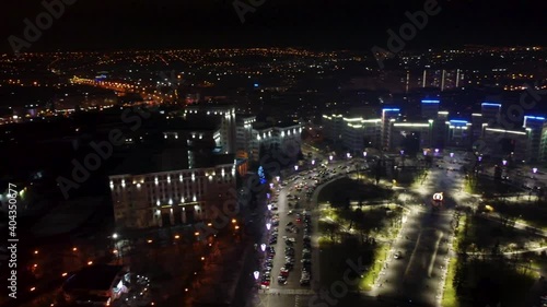 Aerial night right to left panoramic view with holidays illumination lights of Derzhprom, Karazina National University and city center from Freedom Svobody Square Kharkiv, Ukraine photo