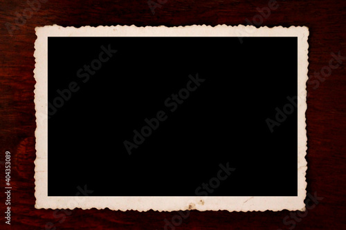 Vintage photo frame with scalloped edge.