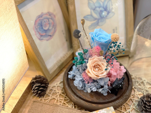 Colorful dried preserved roses, eternity roses in crystal dome