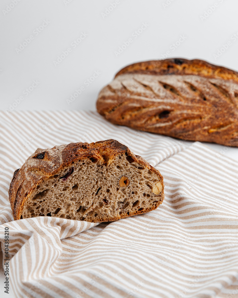 Fresh loaves of bread on a white table Fresh loaves of bread on a white table