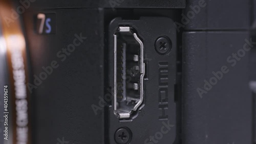 Close up of professional shooting camera details. Action. HDMI connector of the camera, concept of technologies. photo