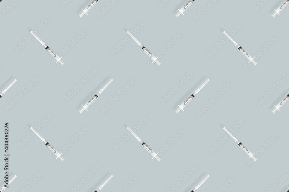 Medical syringes seamless pattern. Medical syringes on a gray background. Medical syringes seamless pattern. Medical syringes on a gray background.