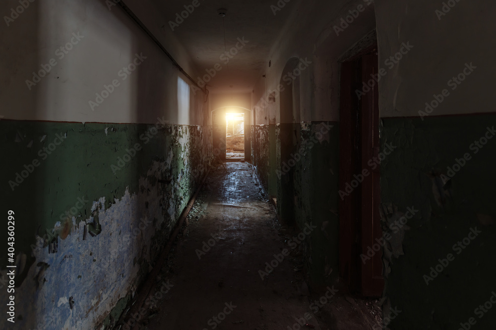 Dark dirty corridor of old abandoned building