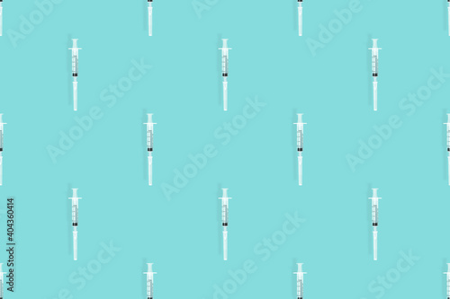 Medical syringes seamless pattern. Medical syringes on an aquamarine background.
