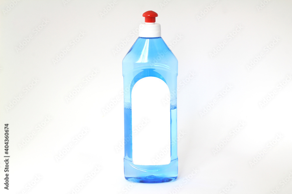 plastic transparent bottle with liquid soap in blue for cleanliness with red cap plastic transparent bottle with liquid soap in blue for cleanliness with red cap