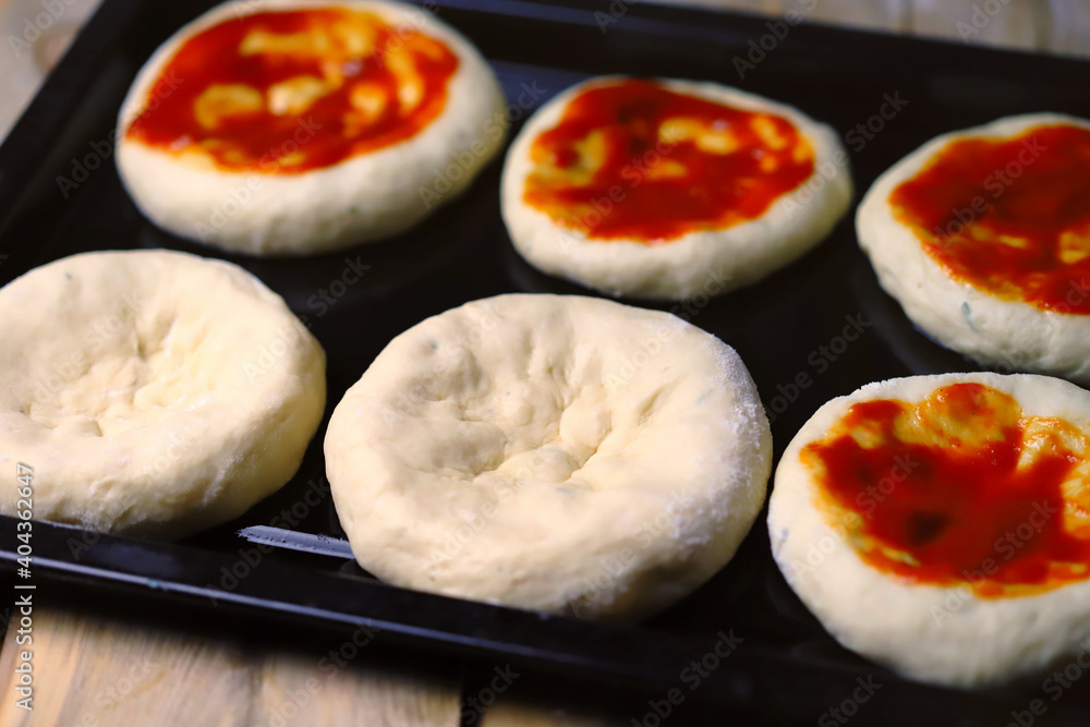 Mini pizza cooking. Home-made fast food. Mini pizza cooking. Home-made fast food.