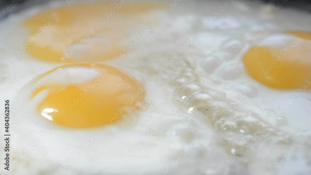 Fried eggs in a frying pan close up Fried eggs in a frying pan close up