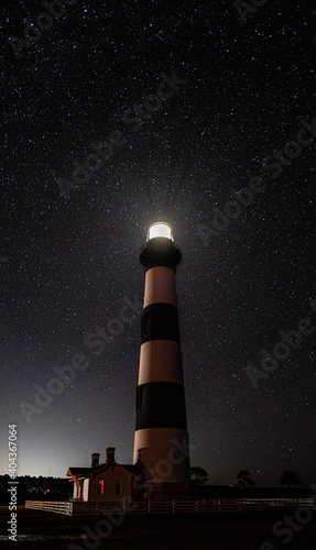 Stars streak across the night sky in front of the Bodie Island Lighthouse in the outer banks of North Carolina, Nag's Head