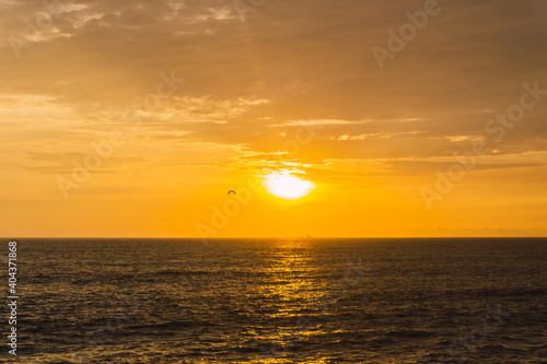 Fototapeta Naklejka Na Ścianę i Meble -  Beautiful sunset in Lima Peru, bright sky and underexposed beach, golden hour, orange sky