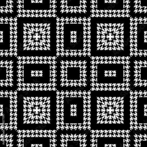 Houndstooth textured black and white seamless pattern. Vector ornamental background. Modern hounds tooth ornaments. Geometric design with squares, rectangles, zigzag, shapes. Repeat grunge texture