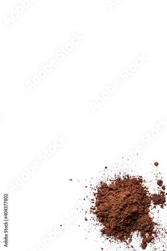Close-up of a pile of chocolate powder isolated on a white background
