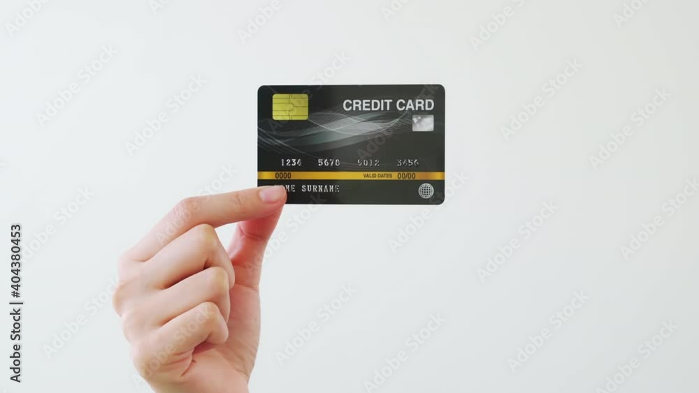 Hand holding mockup credit cards and showing on the white background. Hand holding mockup credit cards and showing on the white background.