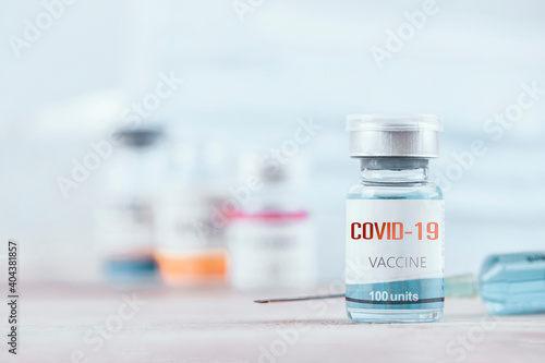 Blue vaccine jar bottle and syringe injection for treatment from corona virus infection and build immunity to viruses Covid-19 , Healthcare And Medical concept.