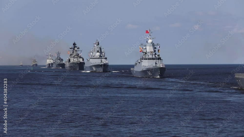 A line ahead of modern russian military naval battleships warships with submarine in the row, northern fleet and baltic sea fleet, summer sunny day, vibrant image A line ahead of modern russian military naval battleships warships with submarine in the row, northern fleet and baltic sea fleet, summer sunny day, vibrant image