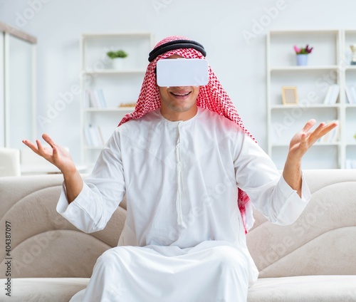 Arab man with virtual reality glasses photo