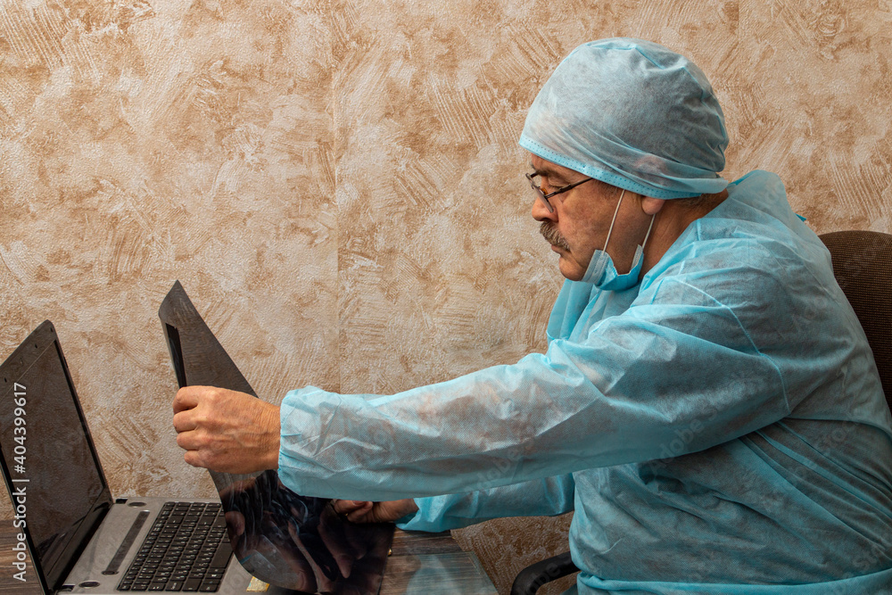 the doctor examines the results of the tomography the doctor examines the results of the tomography