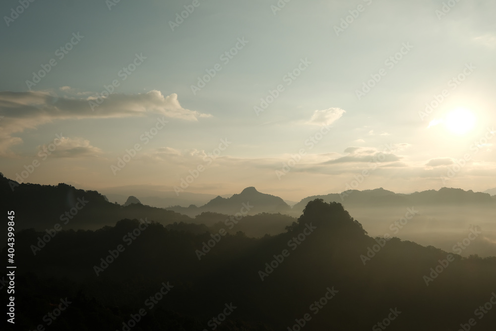 Silhouette mountain landscape with fog in morning. retro color tone