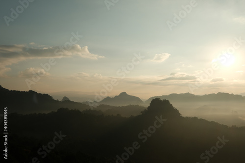 Silhouette mountain landscape with fog in morning. retro color tone