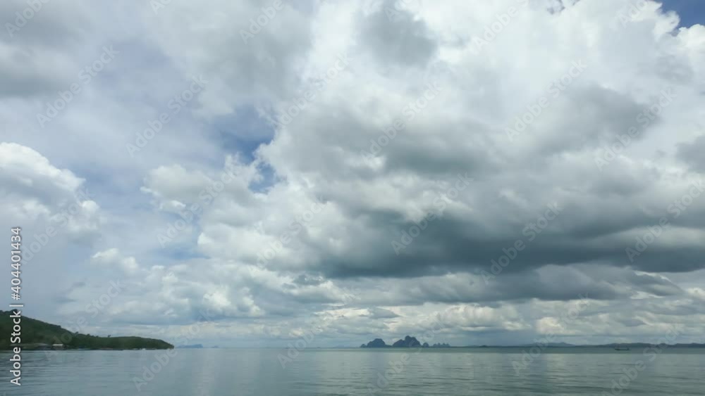dramatic rain stormy clouds over southern Thailand sea. seascape cloudscape nature b-roll footage. sun rays shine through huge fluffy clouds in rainy day. dark clouds spinning horizontal toward island dramatic rain stormy clouds over southern Thailand sea. seascape cloudscape nature b-roll footage. sun rays shine through huge fluffy clouds in rainy day. dark clouds spinning horizontal toward island