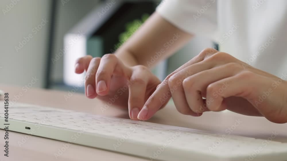 Close up of hand typing on the computer keyboard, on wooden desk. Close up of hand typing on the computer keyboard, on wooden desk.