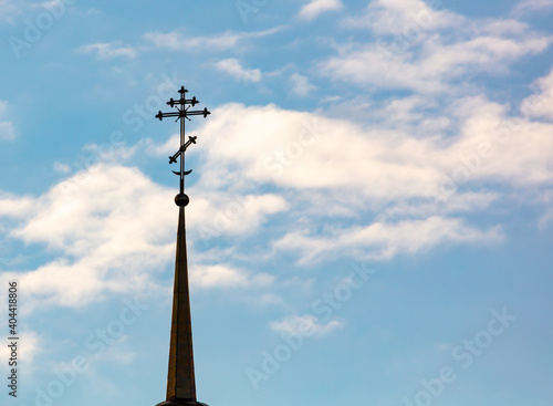 Orthodox cross on the temple against the background of the sky