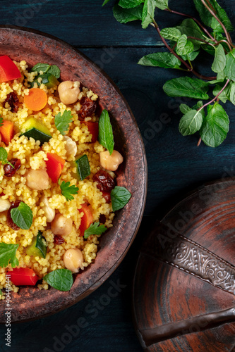 Kuskus, traditional African dish, in a tajine, top shot