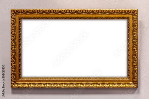 Golden picture frame on wall with clipping path