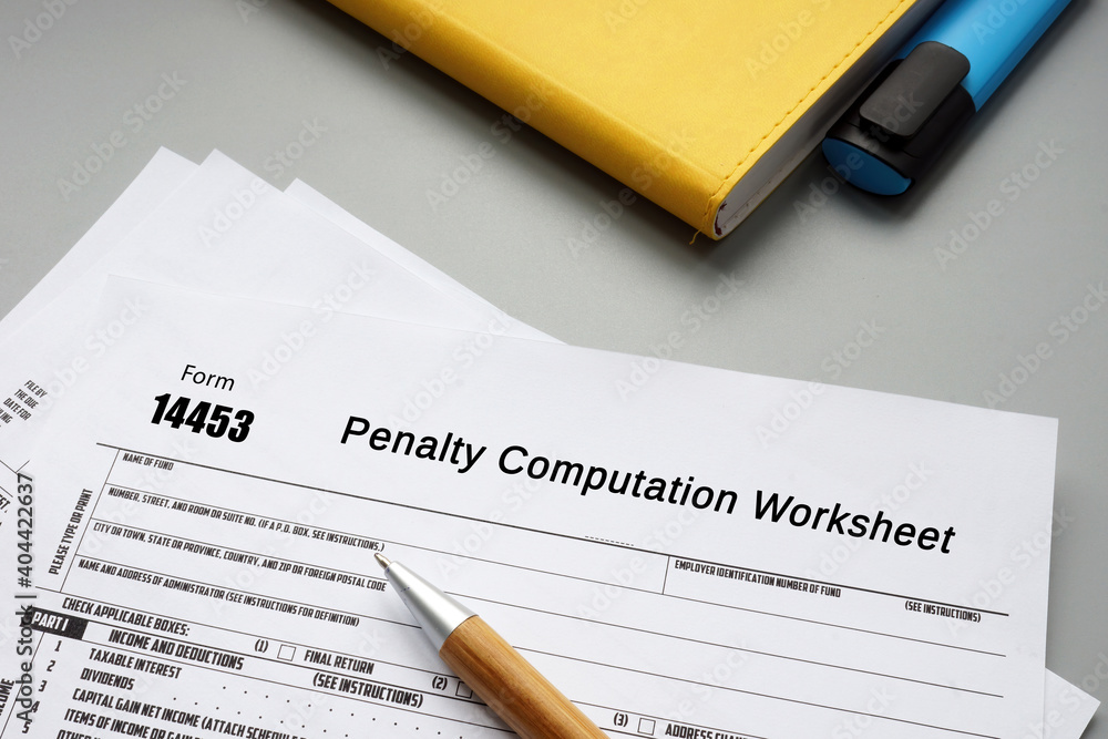 Business concept about Form 14453 Penalty Computation Worksheet with inscription on the piece of paper. Business concept about Form 14453 Penalty Computation Worksheet with inscription on the piece of paper.