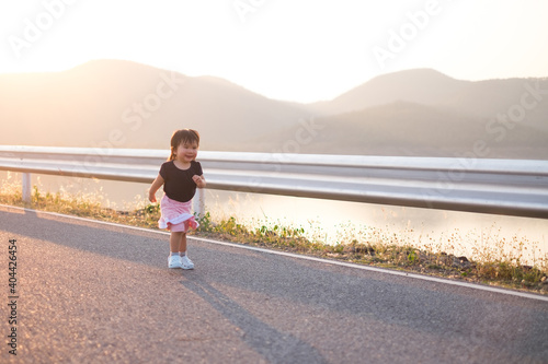 thailand child running on the way with sunset ,wintage tone