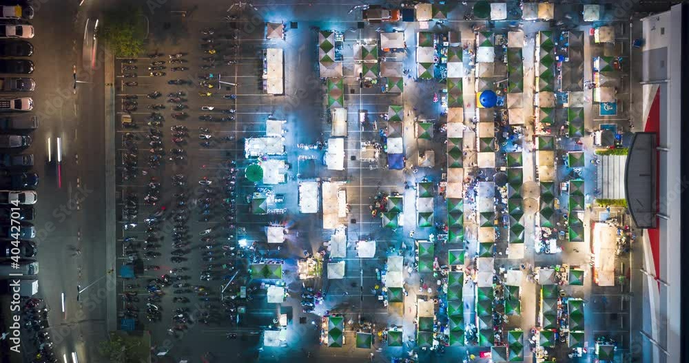 Food fair, festive food, street food or flea market in aerial view. Many people, booth tent, shop, vendor and food stall. Festival in Tha Sala sub district, Amphur Donjan, Chiang Mai, Thailand. Food fair, festive food, street food or flea market in aerial view. Many people, booth tent, shop, vendor and food stall. Festival in Tha Sala sub district, Amphur Donjan, Chiang Mai, Thailand.