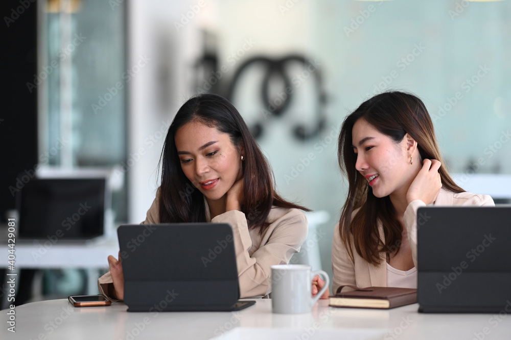 Group of employees using tablet and discussing new ideas together in modern office. Group of employees using tablet and discussing new ideas together in modern office.