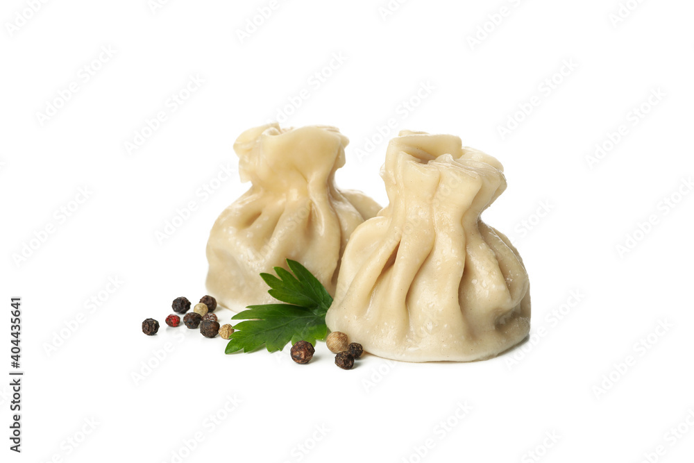 Fototapeta premium Tasty khinkali, parsley and pepper isolated on white background