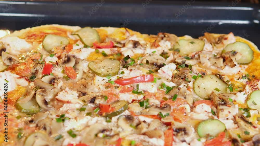 hot pizza with cucumbers mushrooms chicken and pepper. food preparation hot pizza with cucumbers mushrooms chicken and pepper. food preparation