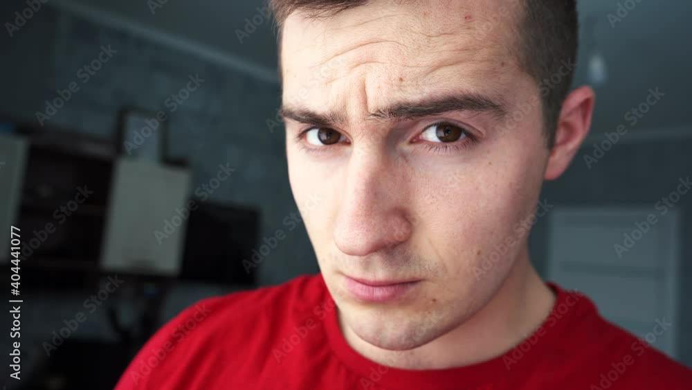 man looks at the camera in surprise man looks at the camera in surprise