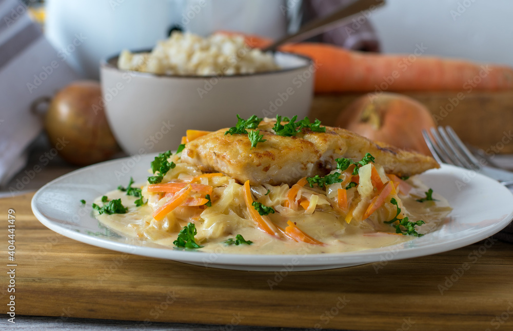 Pan fried fish with brown rice, vegetable and bechamel sauce