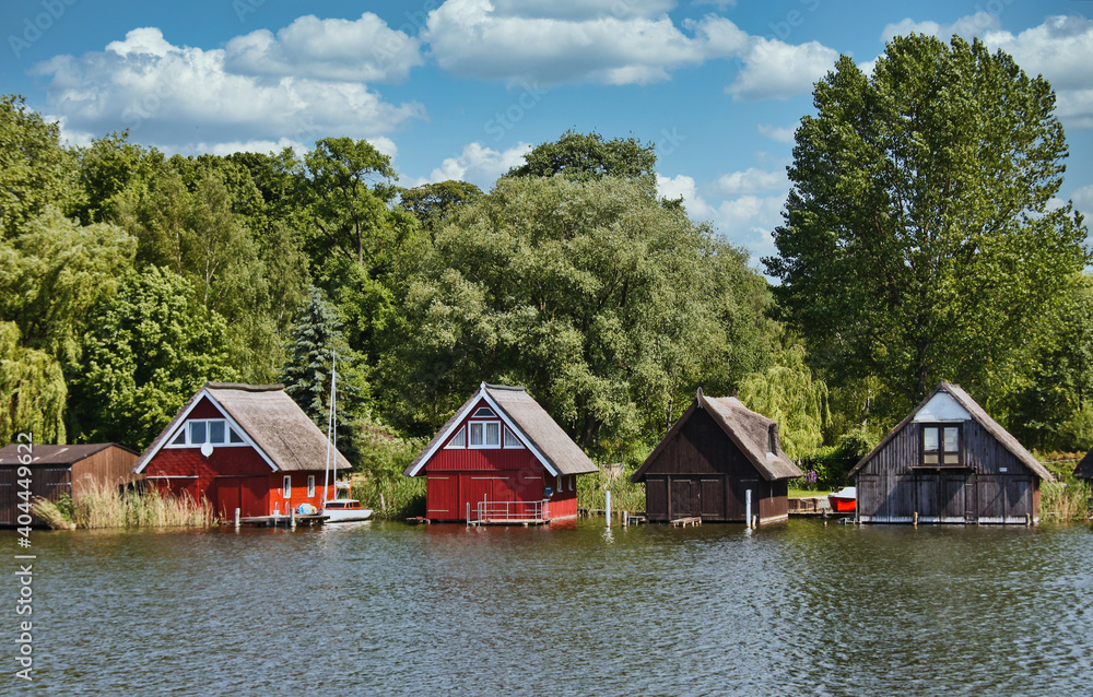 Wooden boathouses in Mueritz National Park, Mecklenburg Lake District,Germany. Mecklenburg-Vorpommern, Germany.
